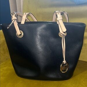 Michael Kors Black and Tan Tote Bag/ purse 
Does have rip on strap
